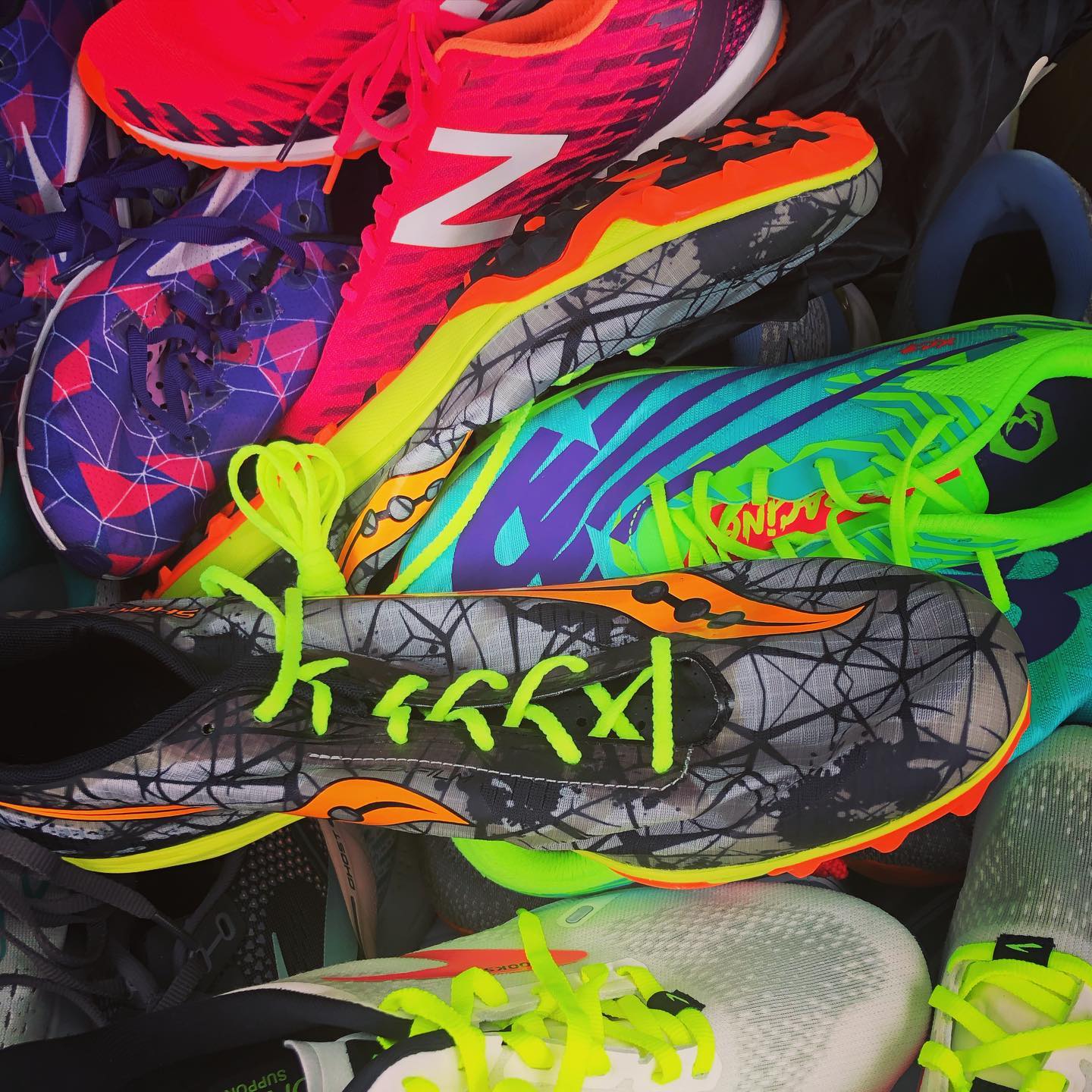 A pile of brightly colored sneakers